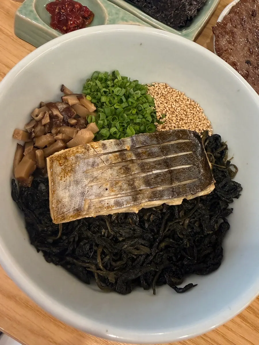Samchi gondre-bap topped with mackerel, gondre herbs, and braised mushrooms