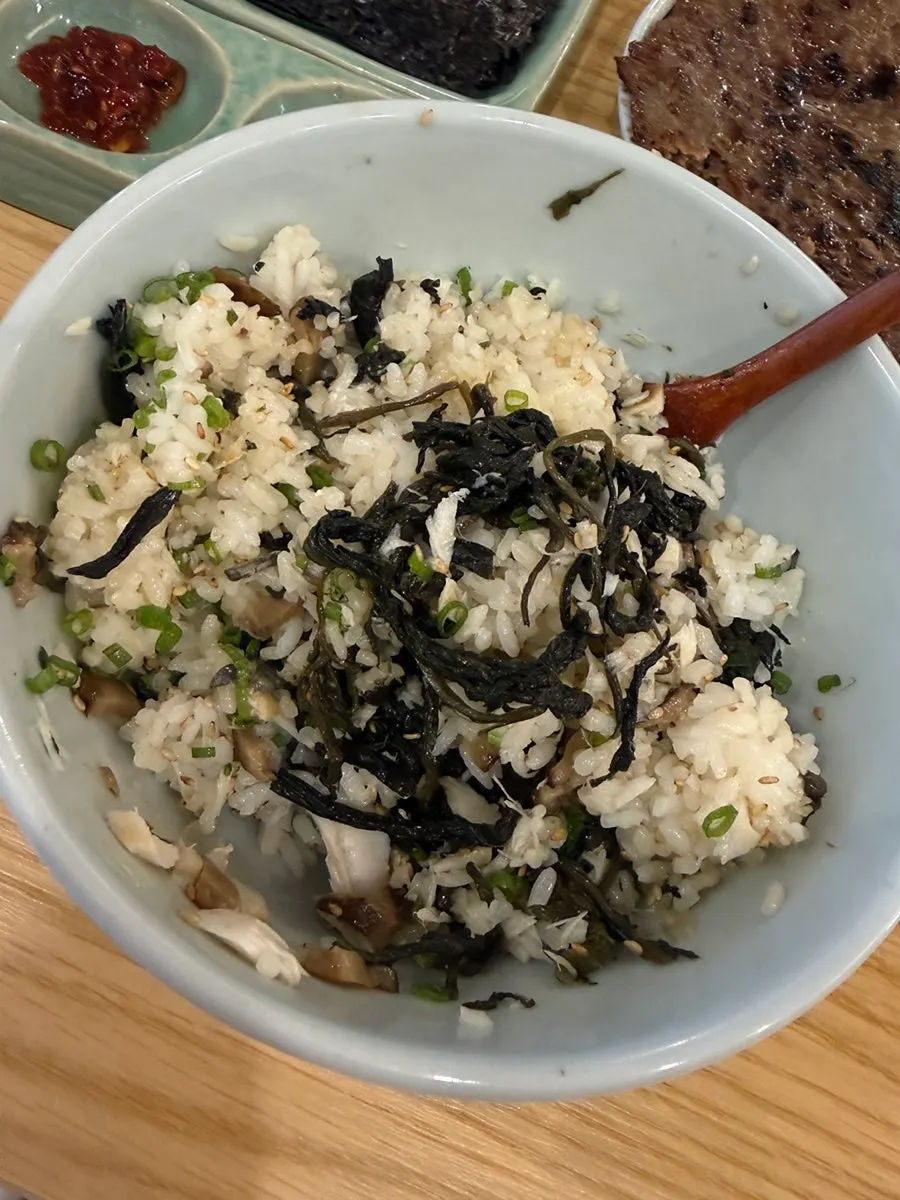 A spoonful of mixed samchi gondre-bap