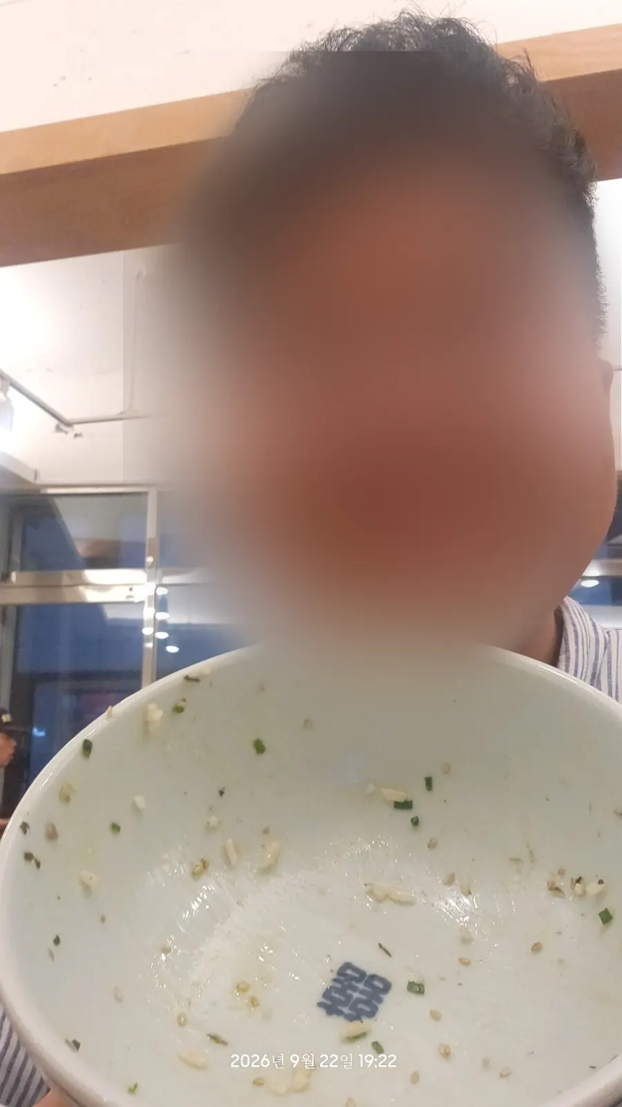 The writer's selfie taken after finishing the meal