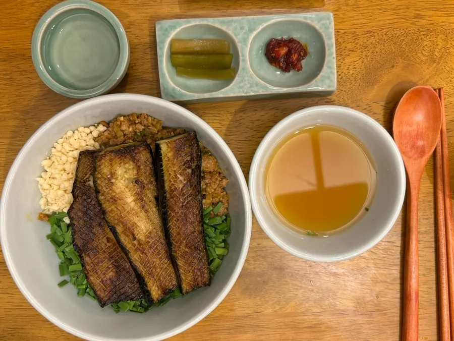 Eggplant doenjang rice bowl topped with big chunks of eggplant