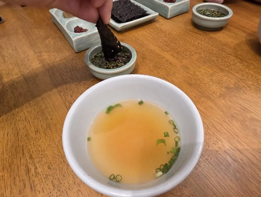 Adding the special sauce to gondre rice