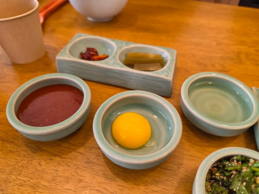 Yukhoe bibimbap topped with egg yolk