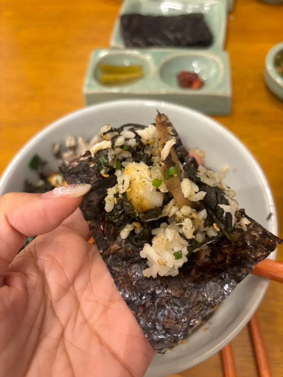 A spoonful of rice with sauce