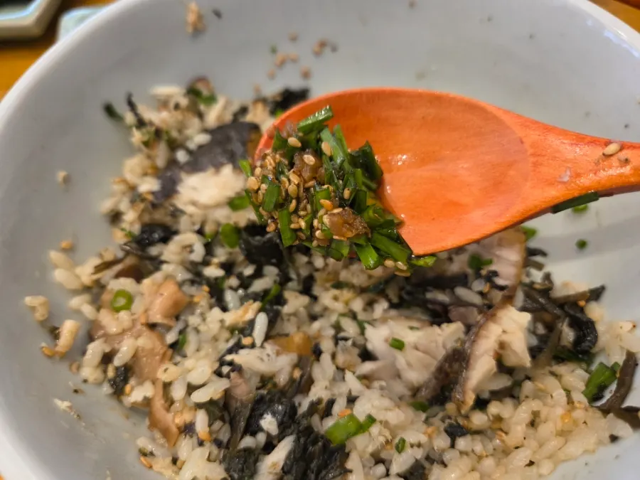 Bite-sized portion of mackerel gondre rice wrapped in seaweed