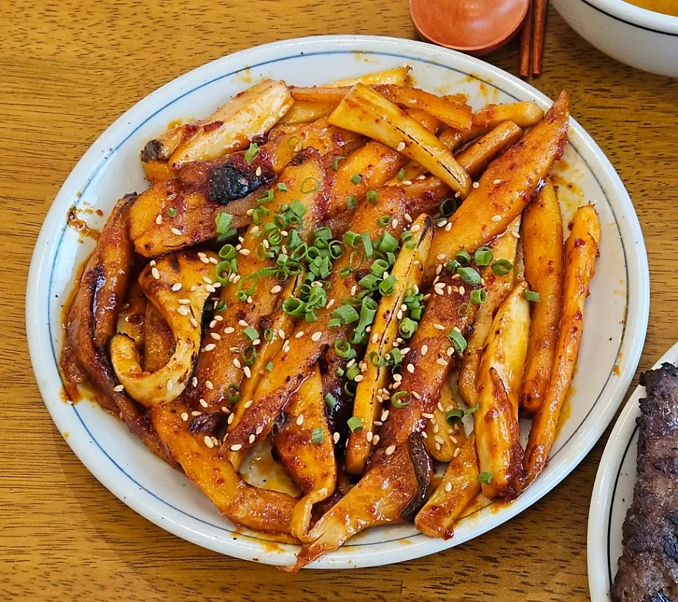 Grilled deodeok mushrooms in a spicy-sweet sauce