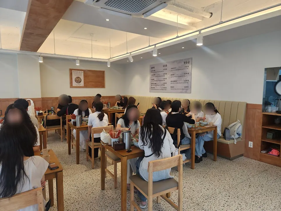 Interior of Hyangtaek Seongseo Keimyung University Branch full of customers
