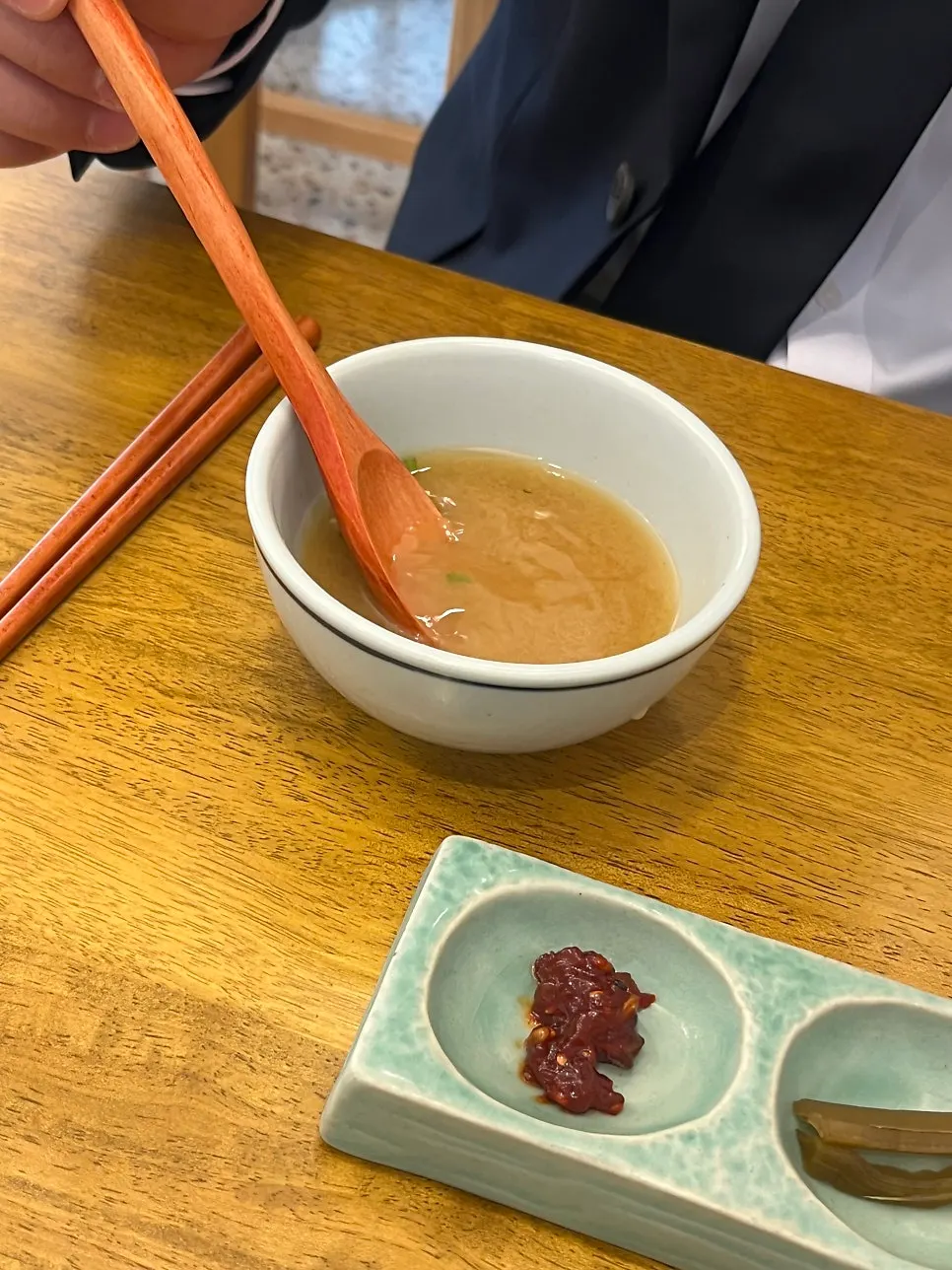 Soup served with the side dishes at Hyangtaek