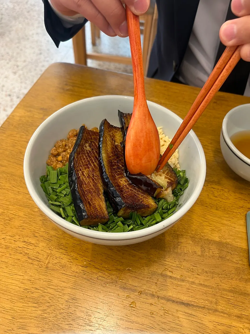 Eggplant doenjang rice bowl topped with doenjang and chives