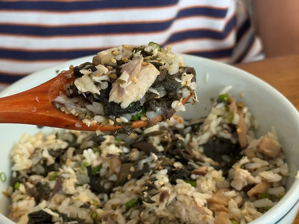 A spoonful of mixed mackerel gondre rice