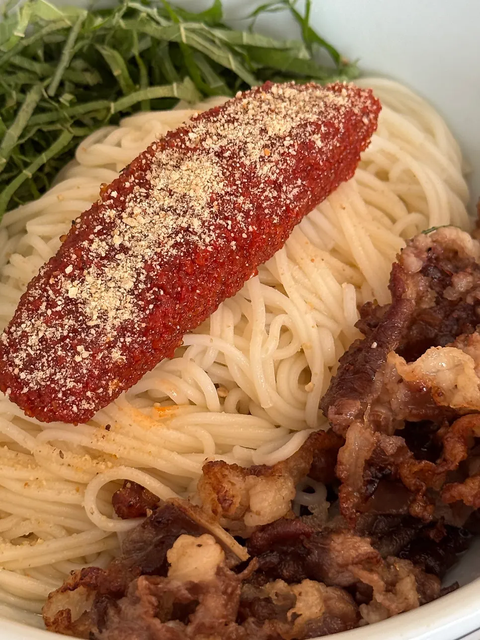 Herring roe bibim noodles with a long strip of roe on top