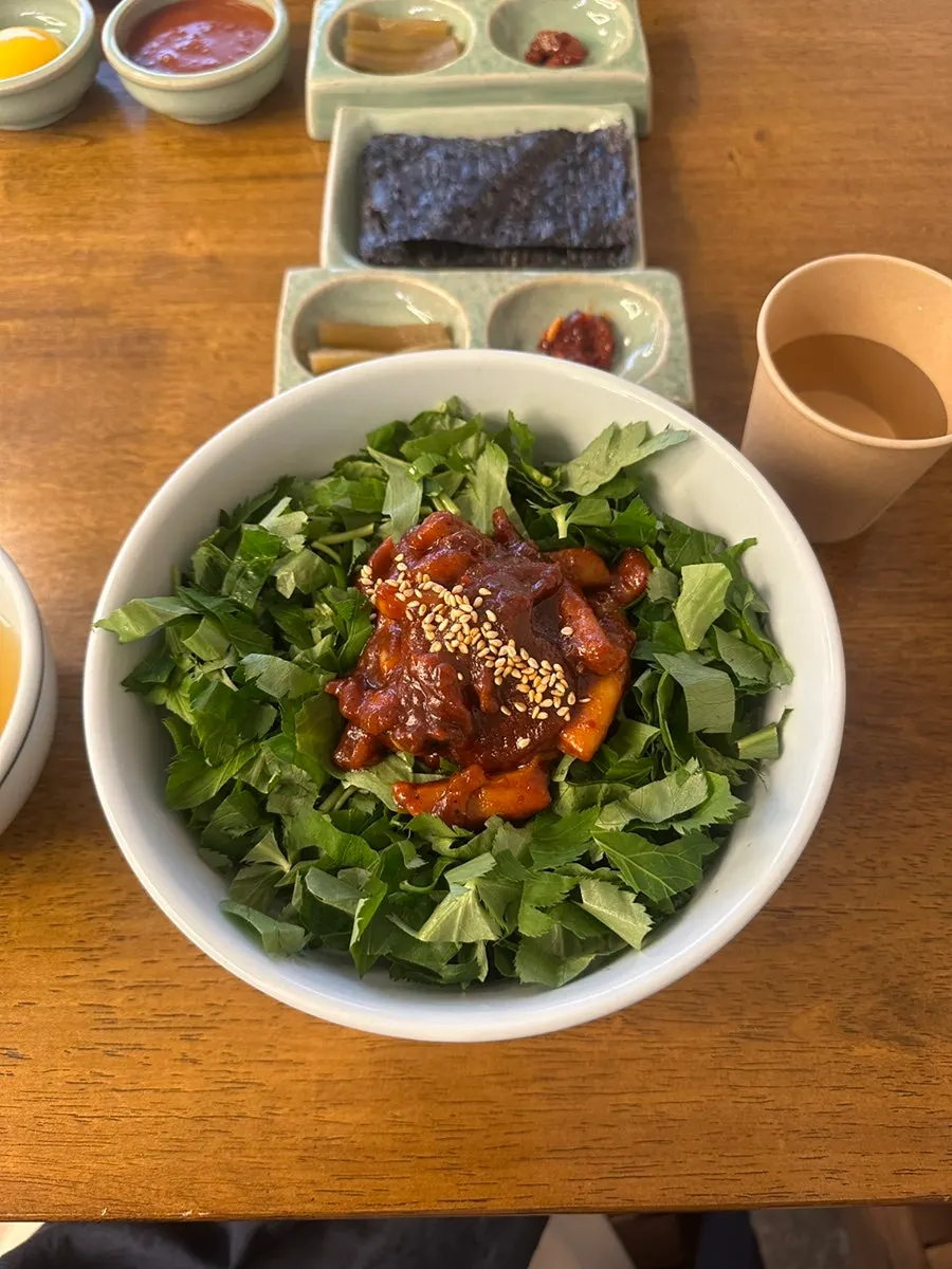 A bowl of spicy-seasoned chamnamul squid rice bowl
