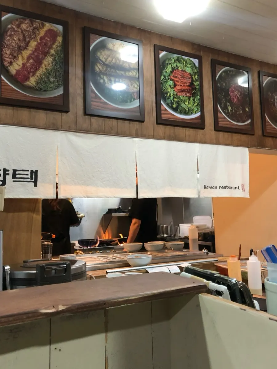 Open kitchen visible from the dining area at Hyangtaek