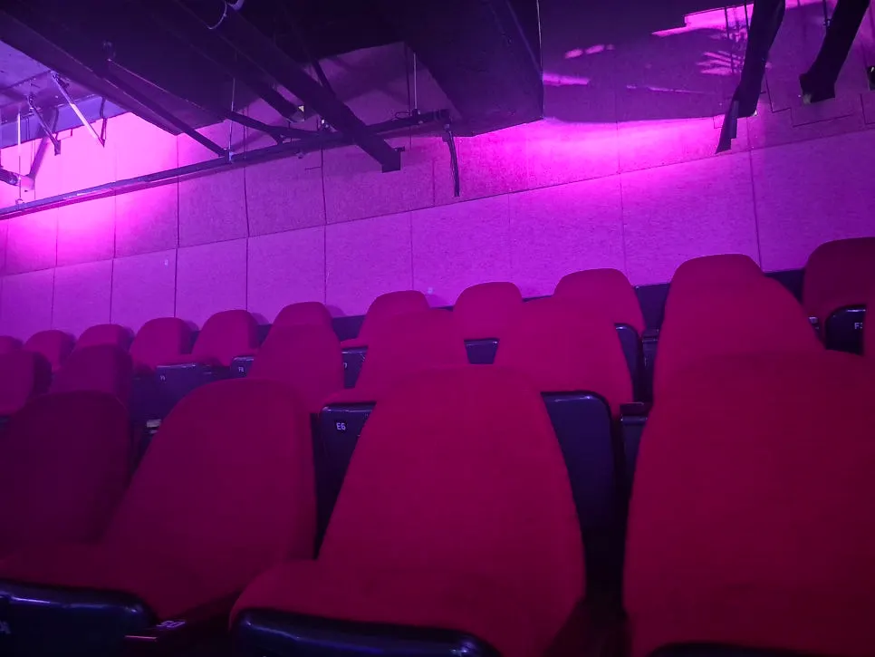 Cushioned theater seats at Nine Theater