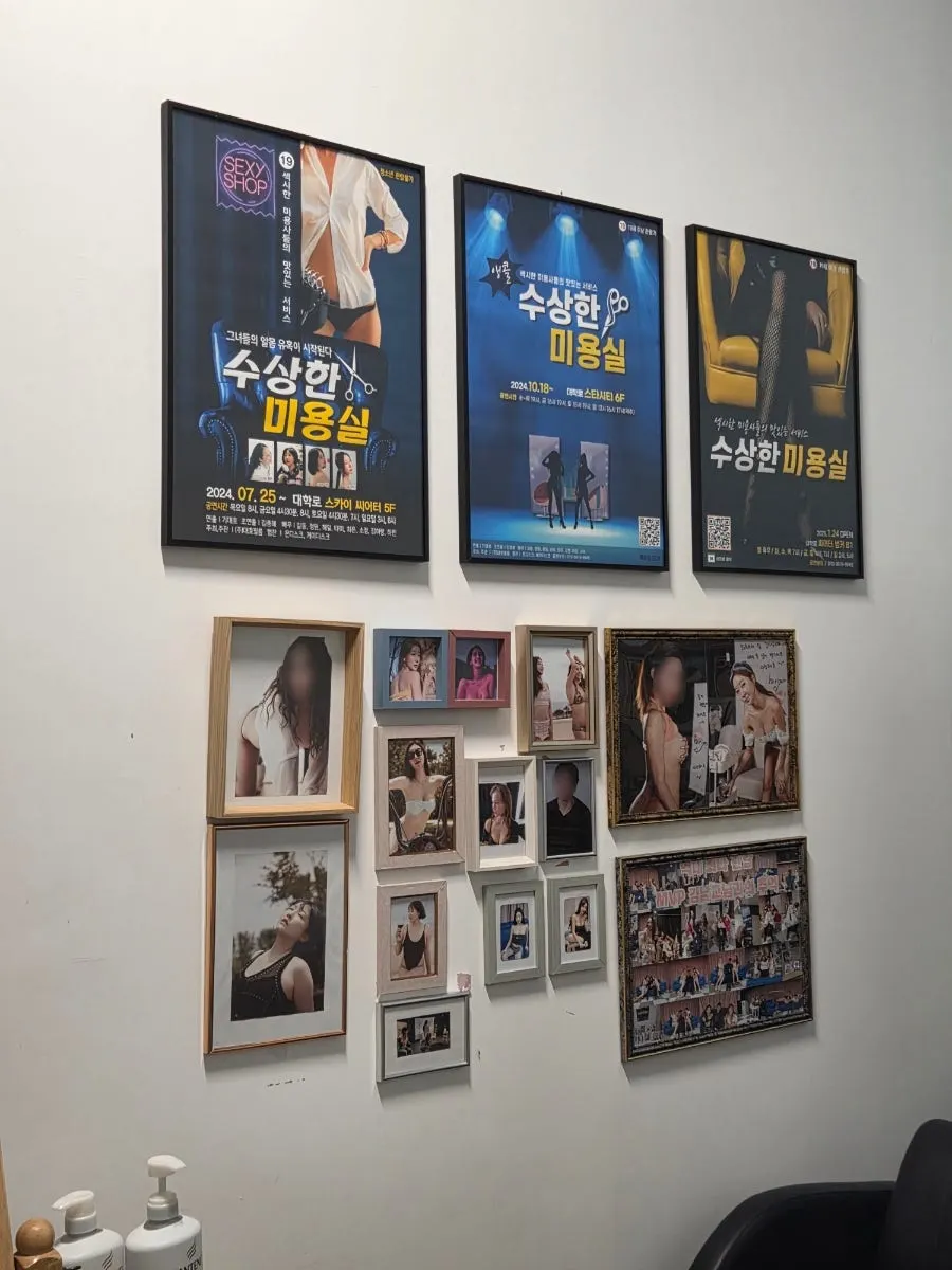 Actor photos hanging in the theater hallway