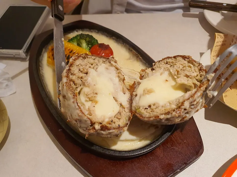 Skillet cutlet topped with lots of cheese