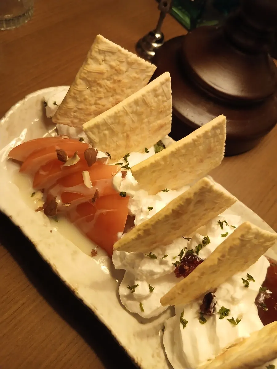 Plate of biscuits with cream cheese and strawberry jam