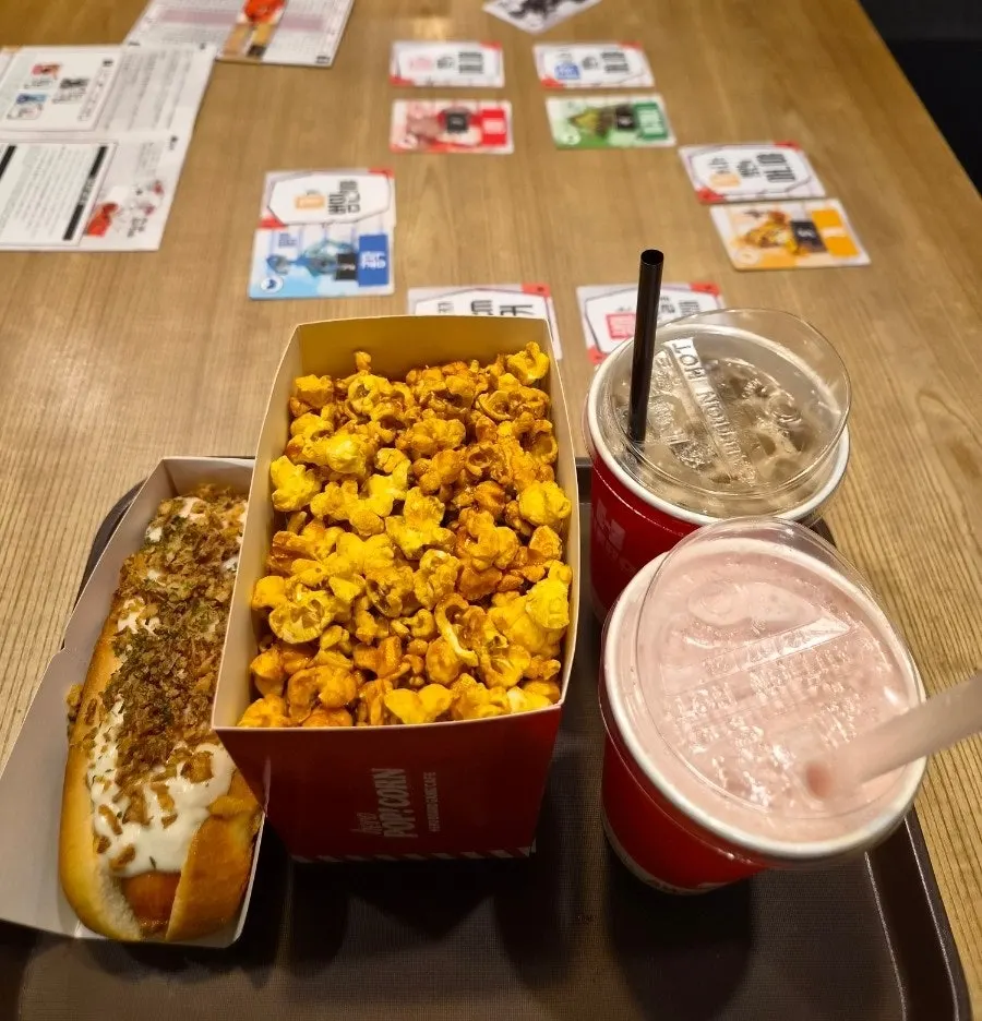 Vertical shot of a table with board games and snacks