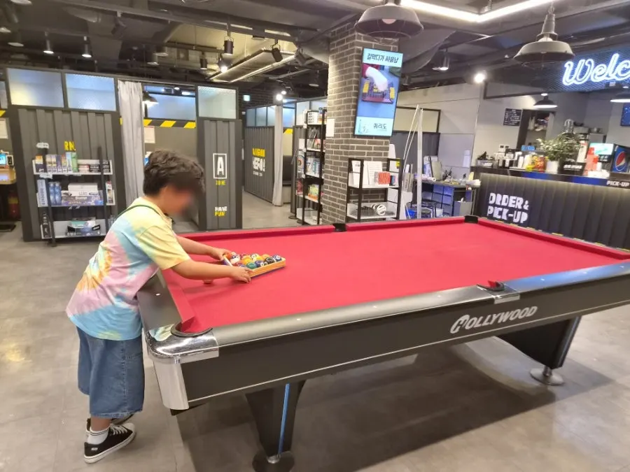 Playing pool together with a kid