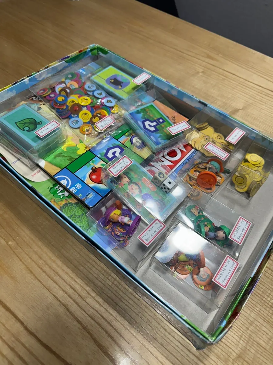 Components of the Monopoly Animal Crossing game