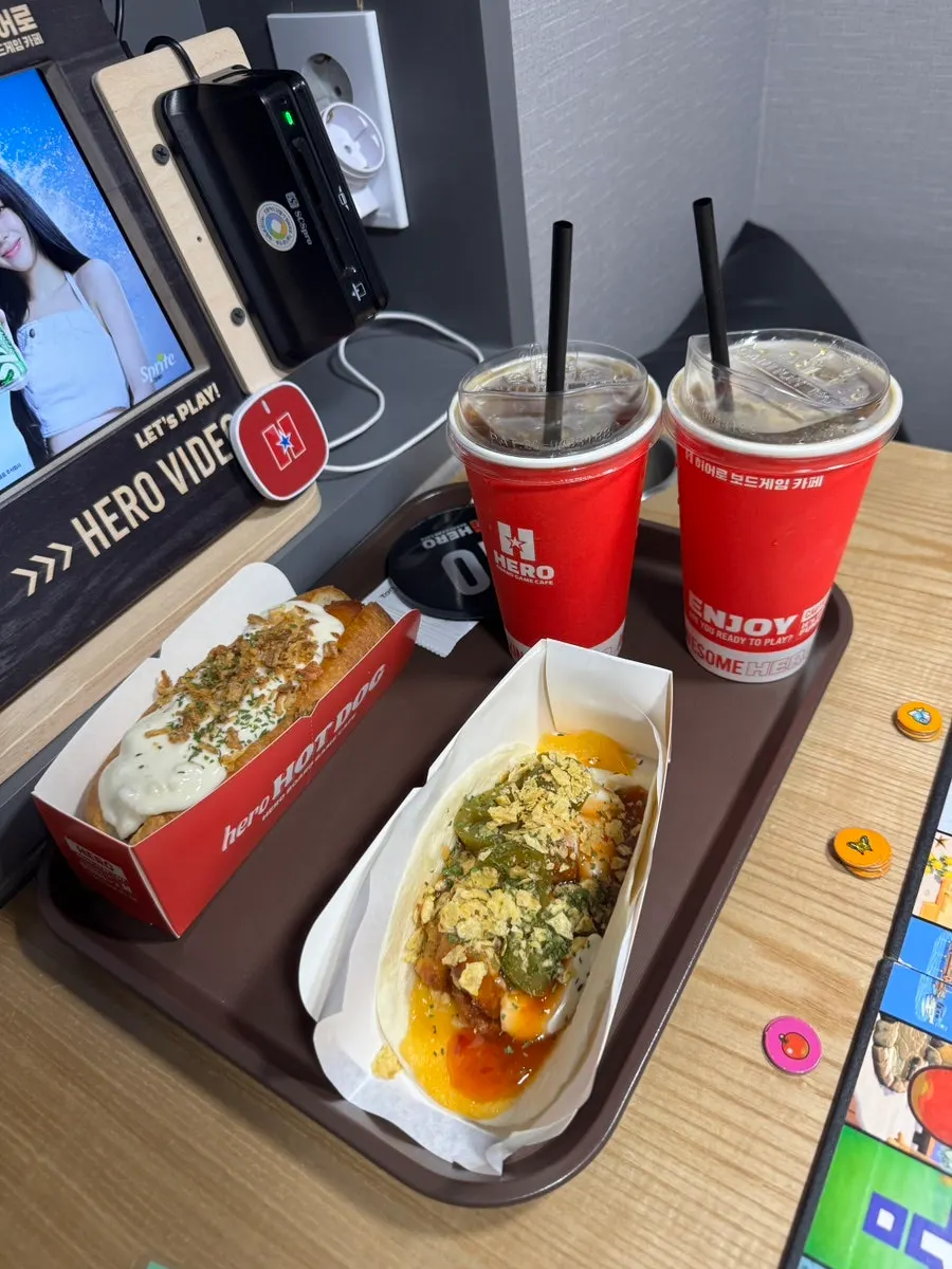 Two iced americanos and ordered snacks