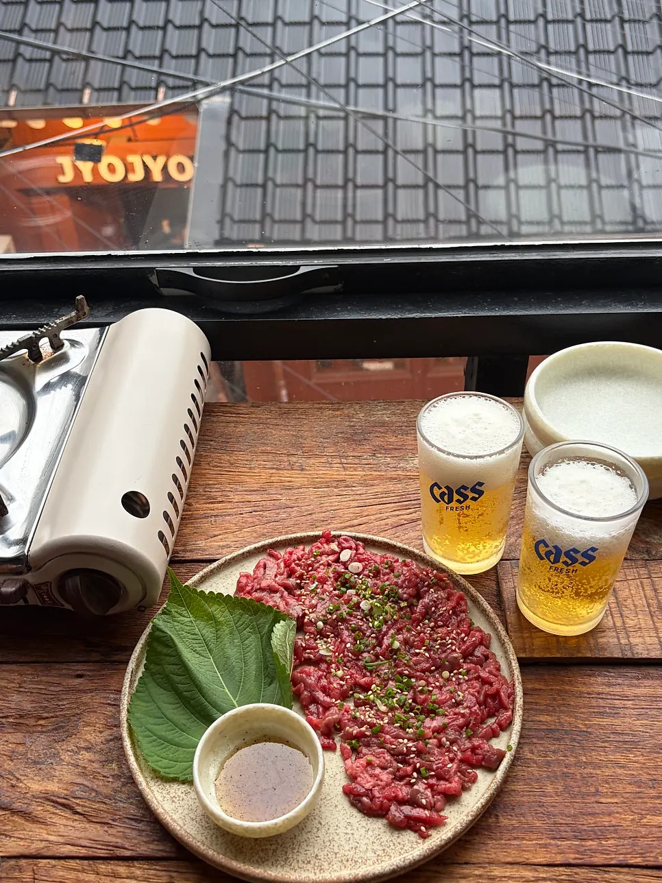 A chopstick-full of beef tartare, the first snack