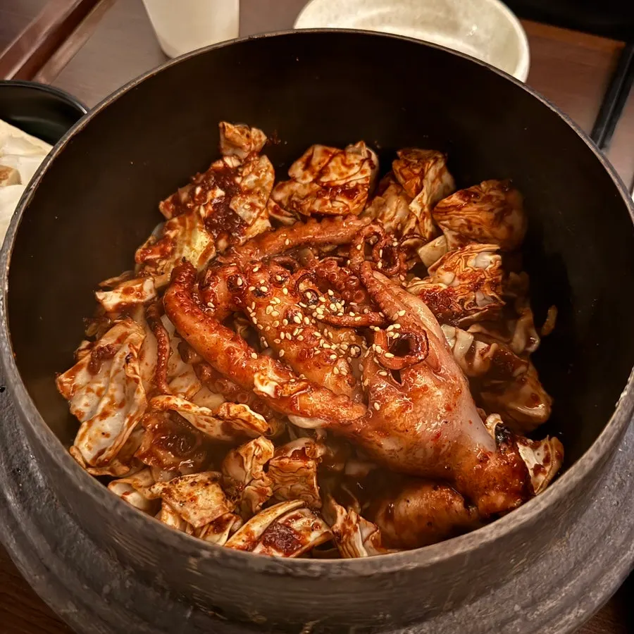 A full spread of Hyehwahwa's straw-fire cauldron knife-cut octopus