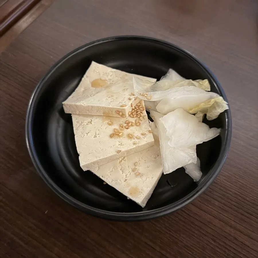 A table spread of octopus and mentaiko pot rice eaten together