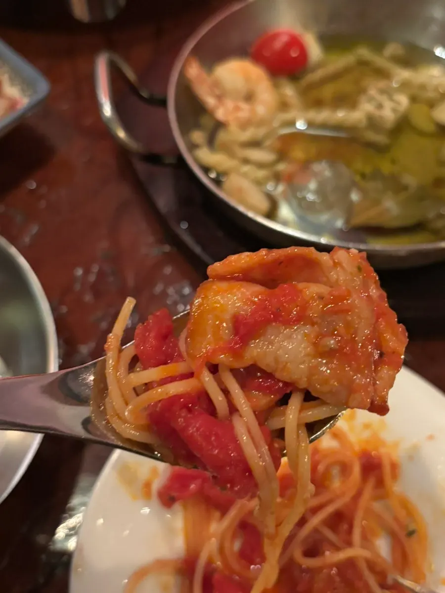 Thin noodles well coated in sauce