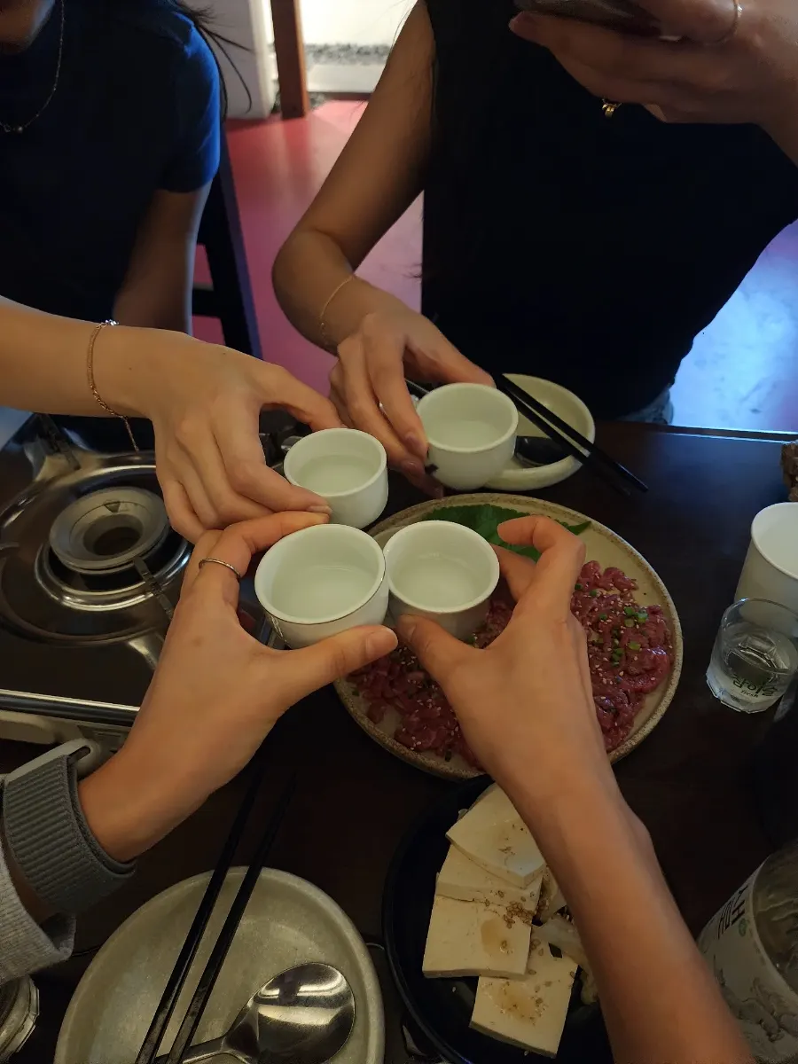 Glass of traditional Korean liquor served as a welcome drink at Hyehwahwa