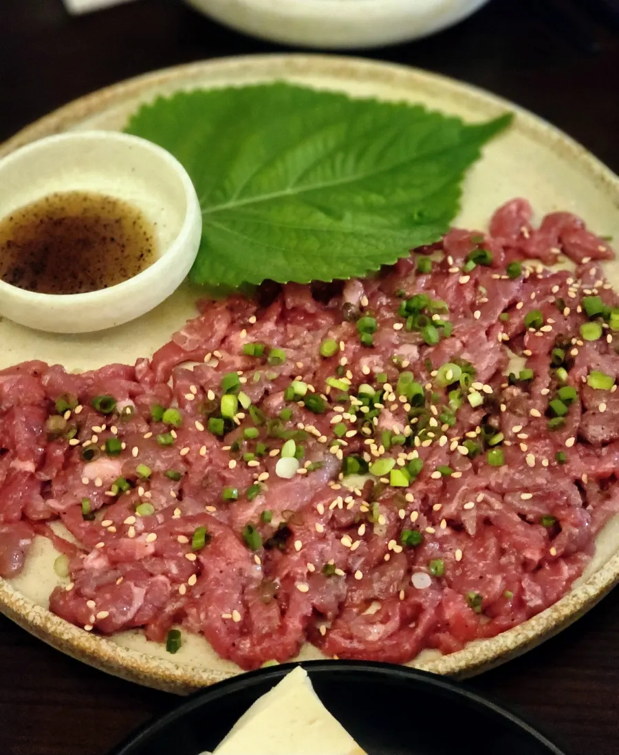 Premium chilled yukhoe half plate topped with scallions and sesame seeds