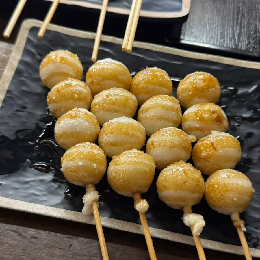 Dango topped with sweet sauce
