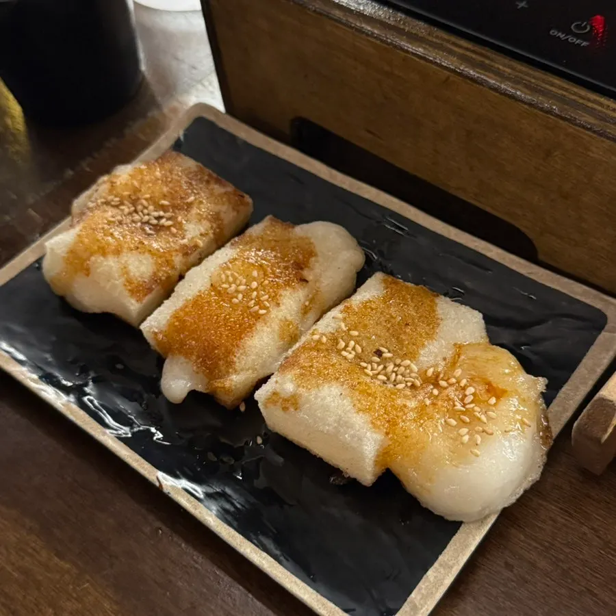 Grilled mochi topped with soy sauce