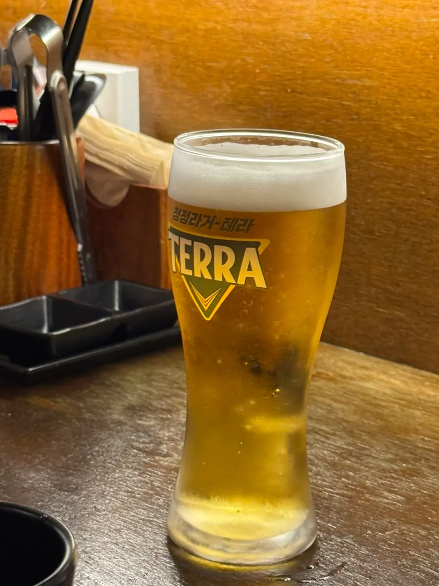 Draft beer ordered alongside the yakitori
