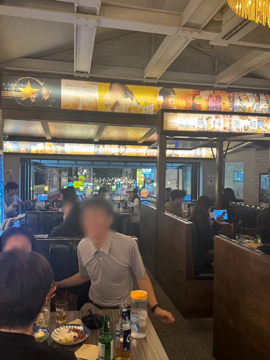 Old Japanese liquor ad posters on the wall