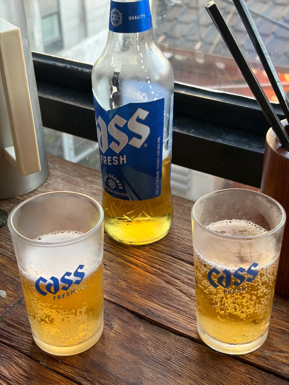 Cold beer set at the window seat