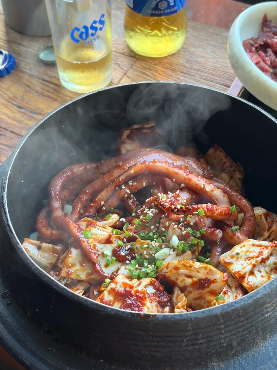 Cooking scene showing the smoky char being added to the octopus