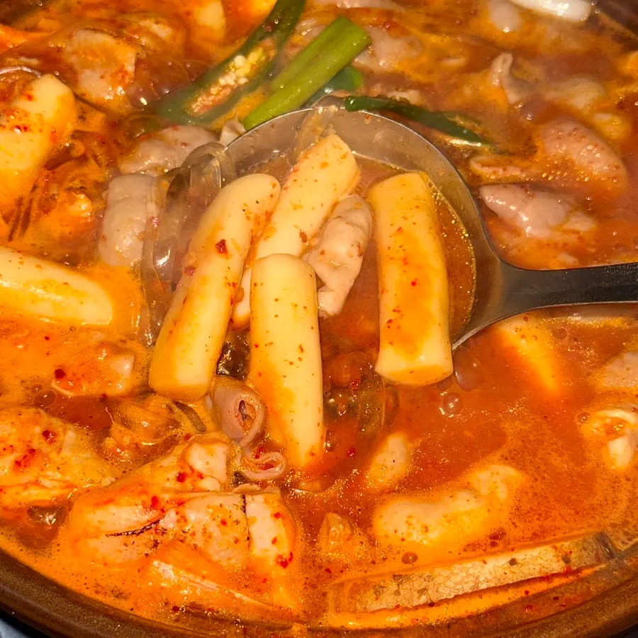 A piece of soft rice cake soaked in broth