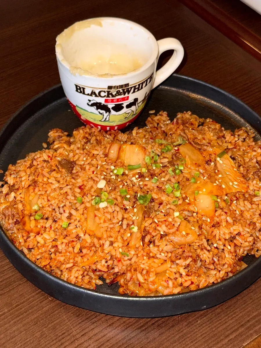 Cheese served in a mini cup alongside kimchi fried rice