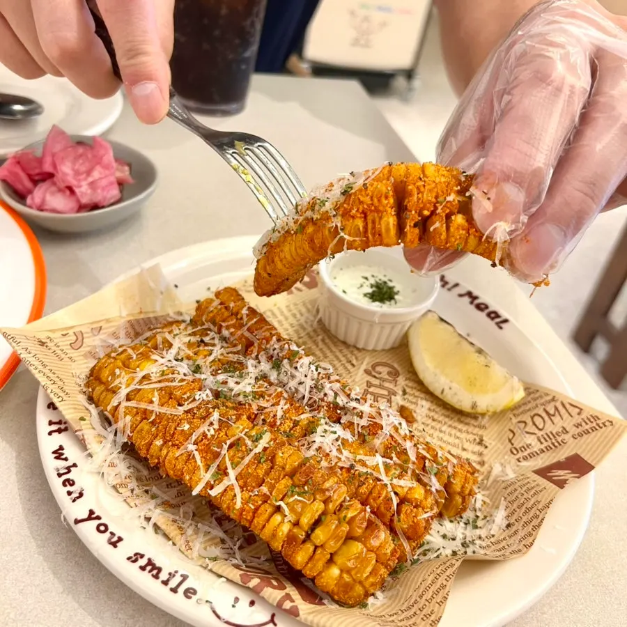Eating fried corn at Omil
