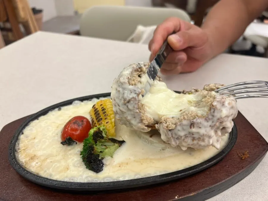 Finished sizzling cheese katsu with cheese