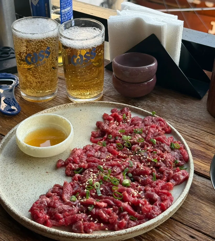 Korean beef yukhoe served alongside beer