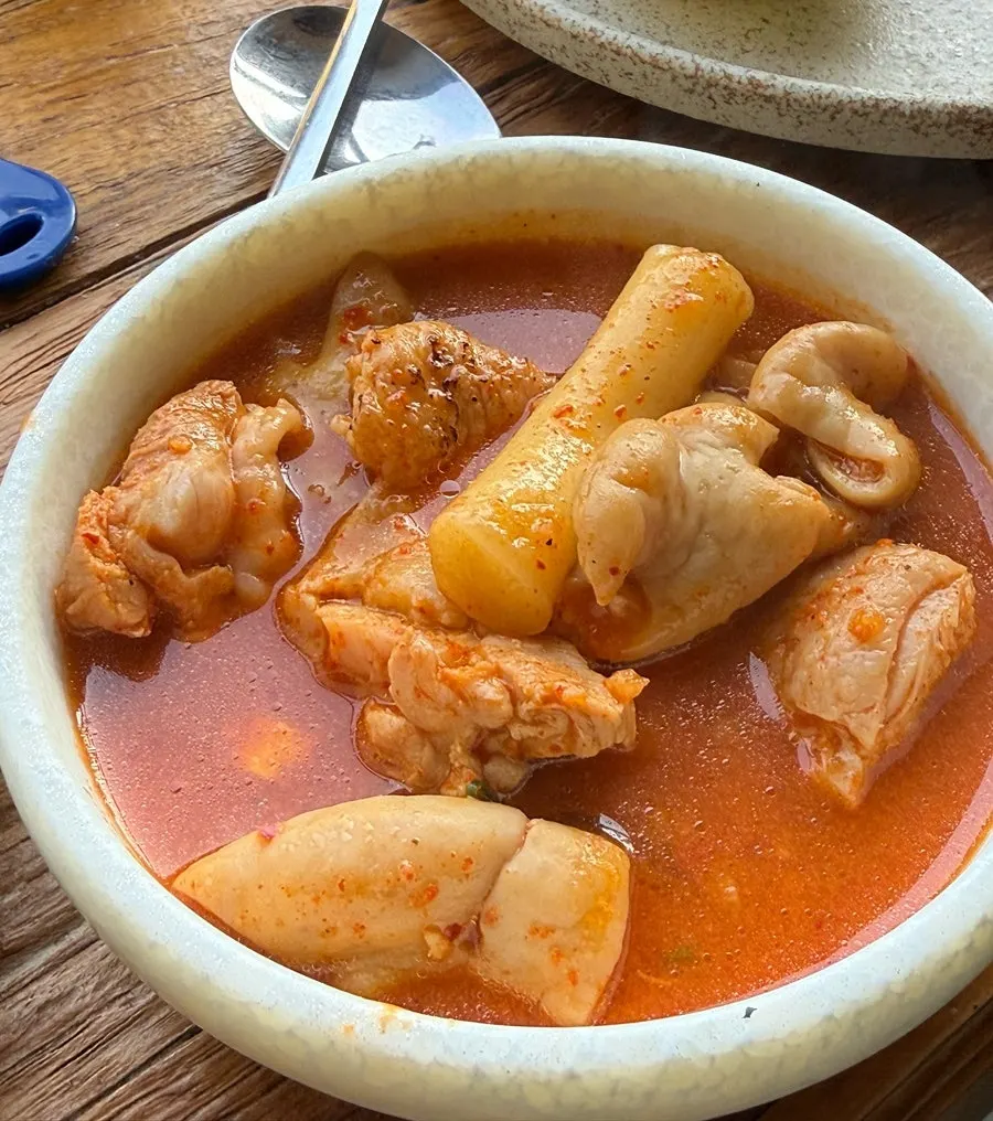The spicy gopdori-tang broth simmering