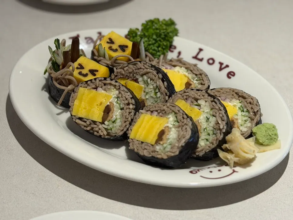 Soba maki served with eggs drawn with expressions