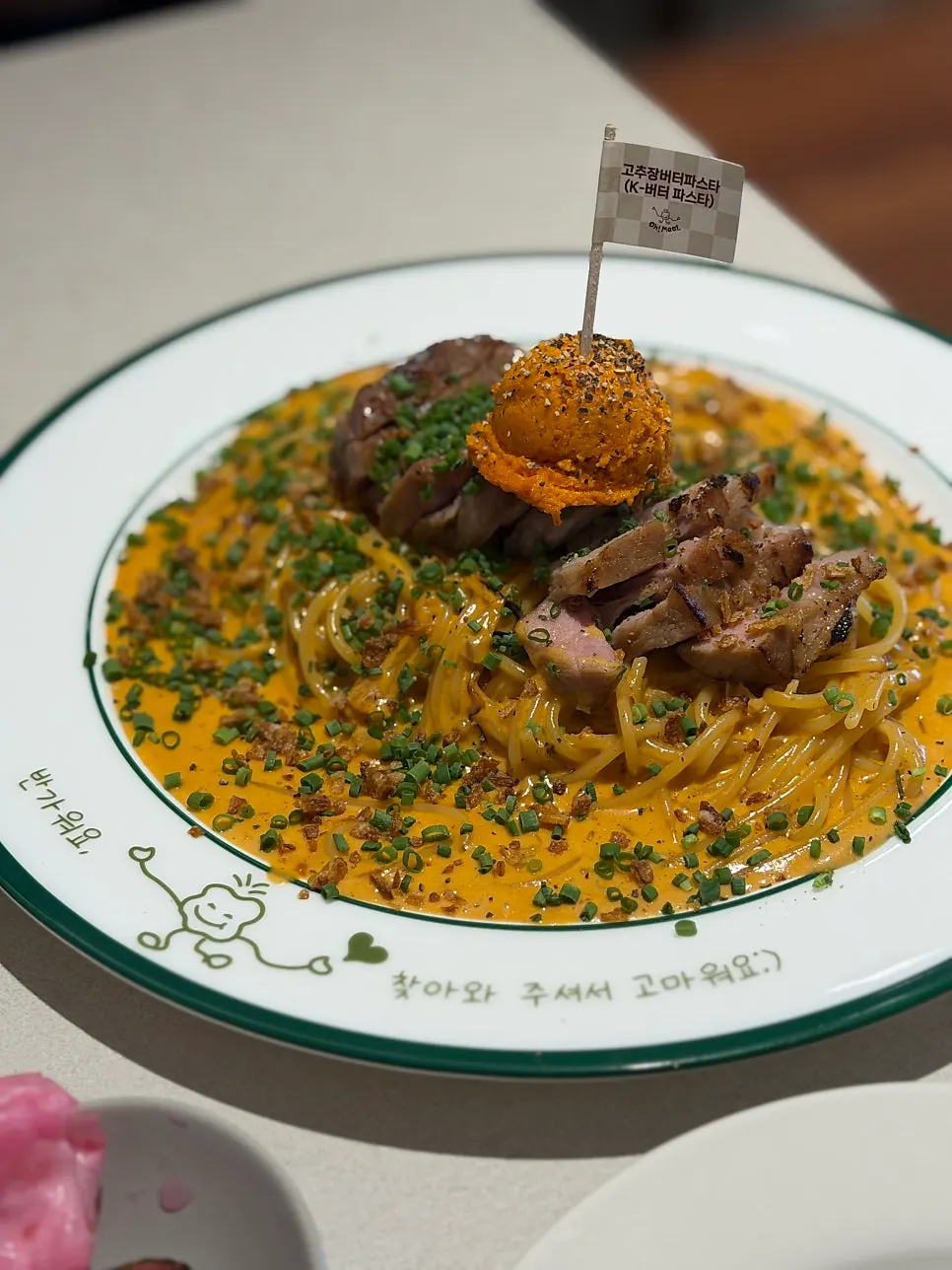 Gochujang butter pasta served on a wide plate
