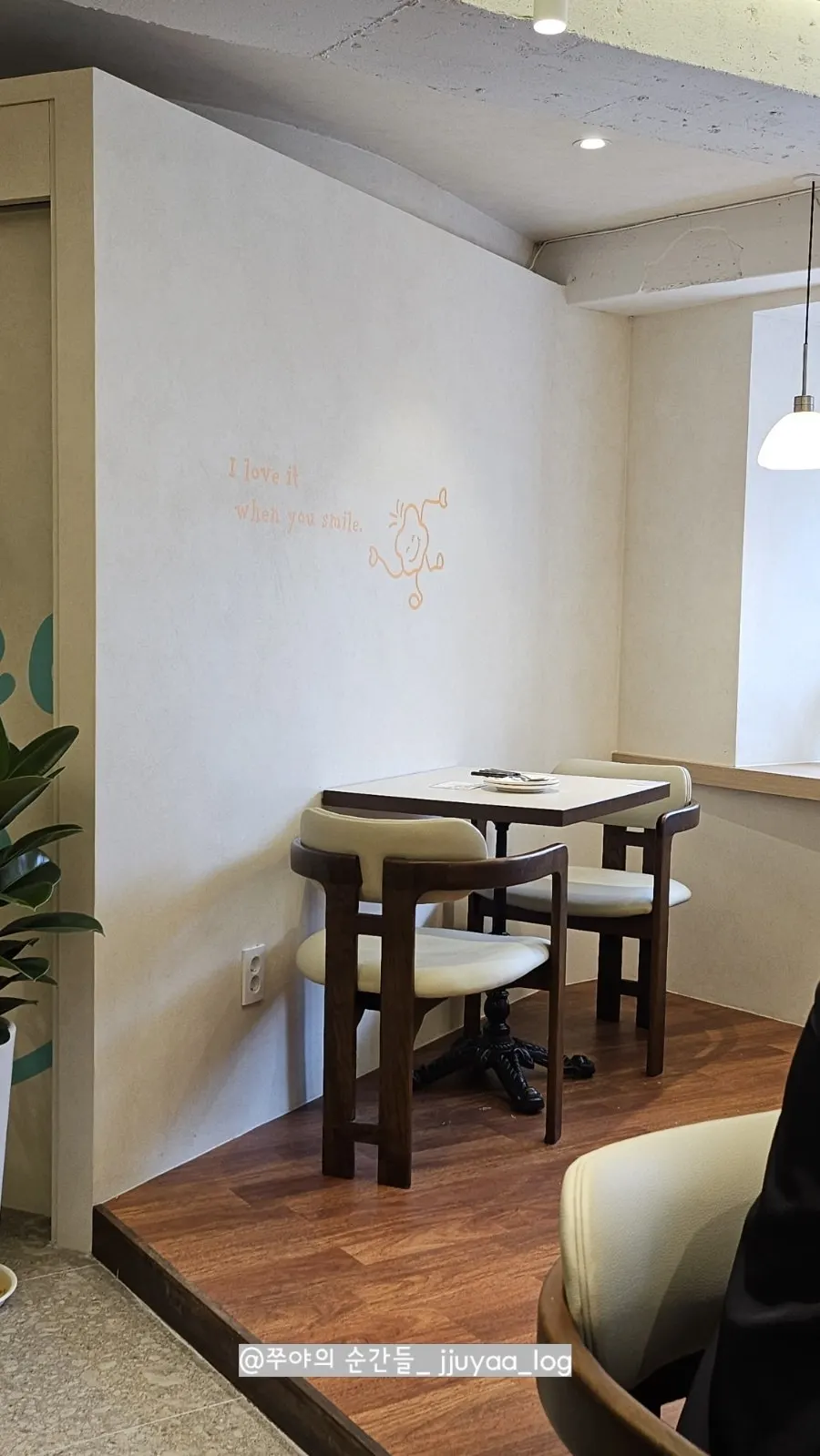 Window-side table seating at Omil Hyehwa Daehangno