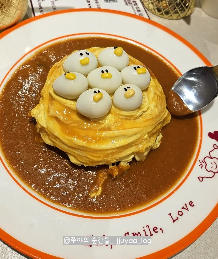 Cross-section of rubber duck omurice showing salmon fried rice