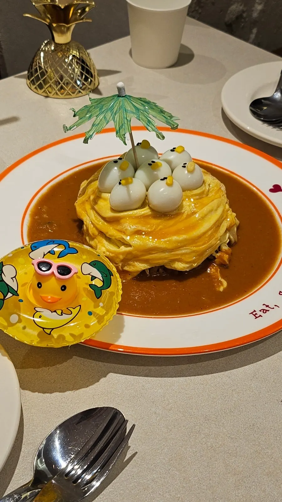 Pineapple ade in a pineapple-shaped gold cup