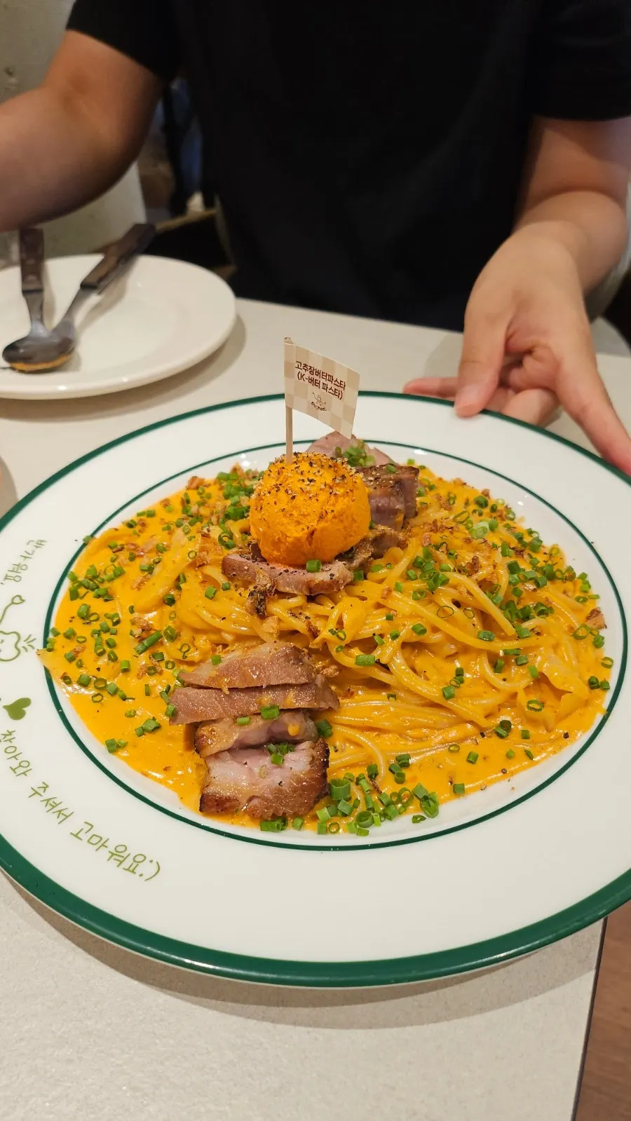 Table spread of omurice, pasta, and ade trio combo