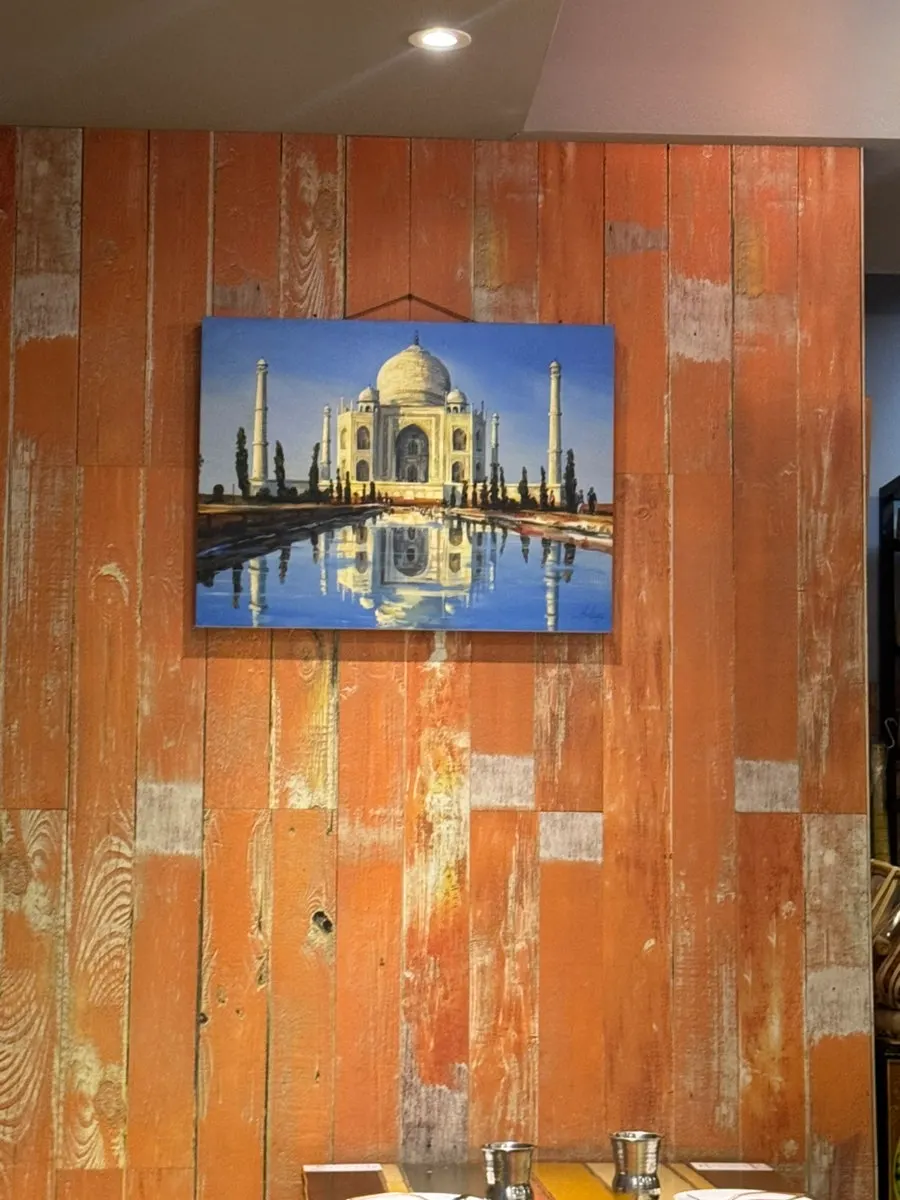 Restaurant interior with a photo of the Taj Mahal
