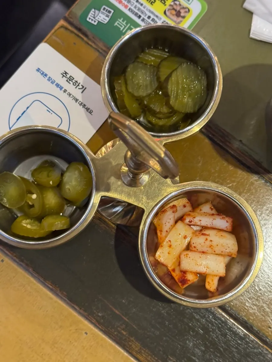 Complimentary side dishes served with curry